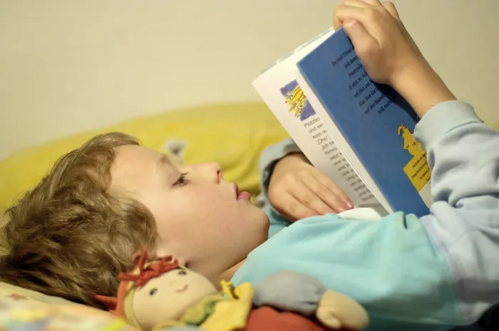 Framed Print : Boy Reading in Bed Print