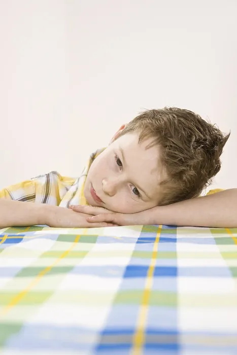Framed Print : Boy Sitting at a Table, Bored Print