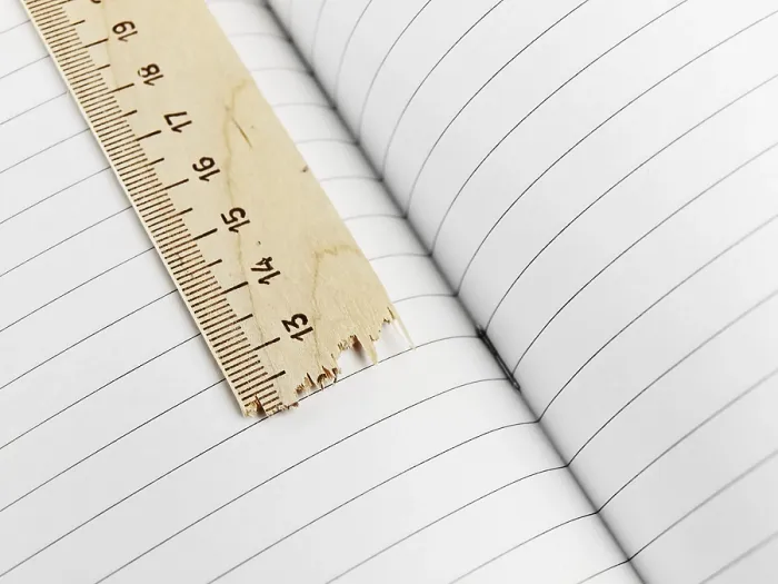 Framed Print : Broken Ruler Over Exercise Book Print Framed Print : Broken Ruler Over Exercise Book Print