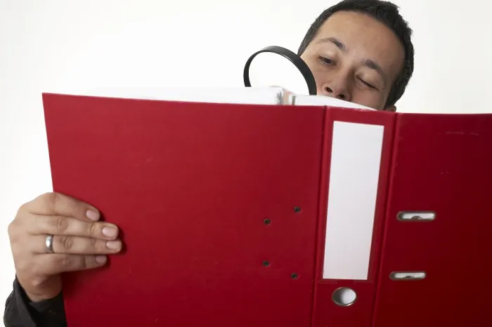 Framed Print : Businessman Verifies Documents Print Framed Print : Businessman Verifies Documents Print