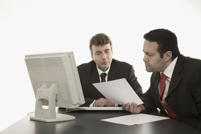 Framed Print : Two Businessmen Reviewing Documents Print Framed Print : Two Businessmen Reviewing Documents Print