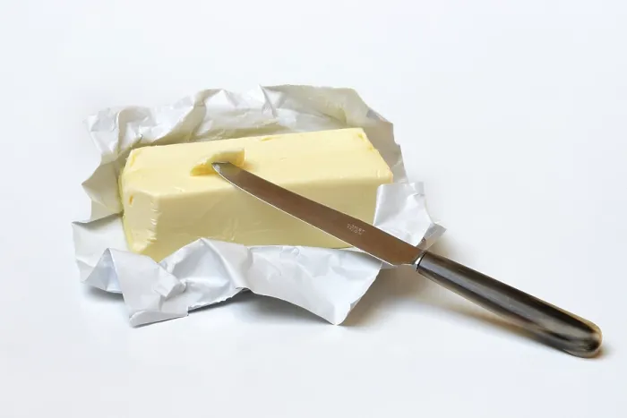 Framed Print : Butter with Opened Package and Knife Print Framed Print : Butter with Opened Package and Knife Print