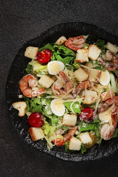Framed Print : Print of Caesar Salad with Tiger Prawns on a Black Plate Framed Print : Print of Caesar Salad with Tiger Prawns on a Black Plate