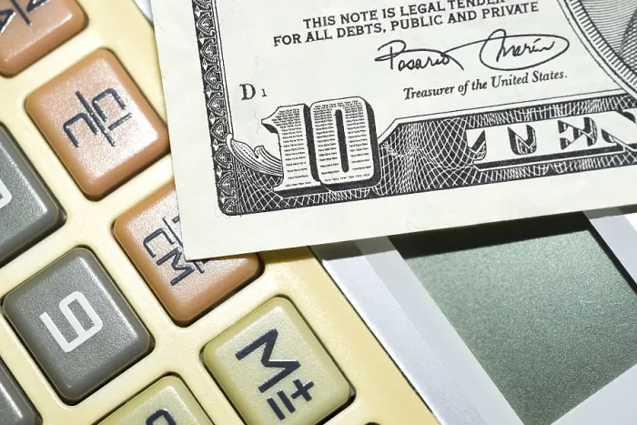 Framed Print : Calculator and ten dollar Print from imageBROKER Framed Print : Calculator and ten dollar Print from imageBROKER
