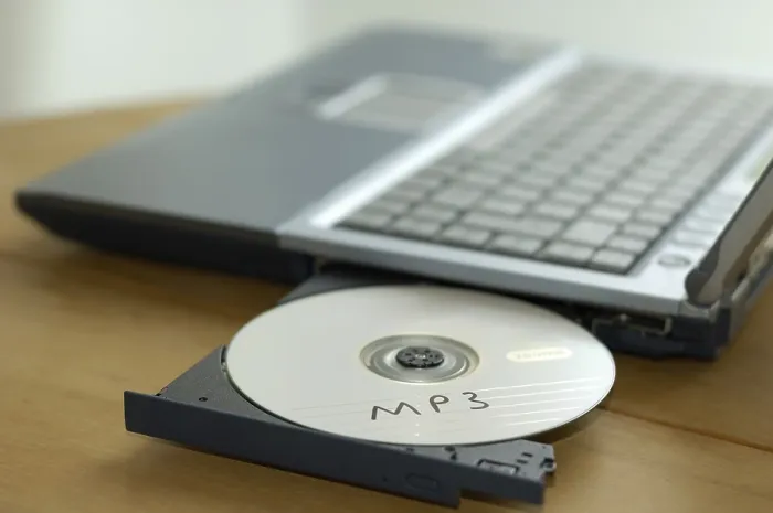 Framed Print : Print of CD labeled MP3 in notebook CD drive