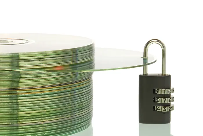 Framed Print : Secure Data Storage Print: Locked CD Stack with Padlock Framed Print : Secure Data Storage Print: Locked CD Stack with Padlock