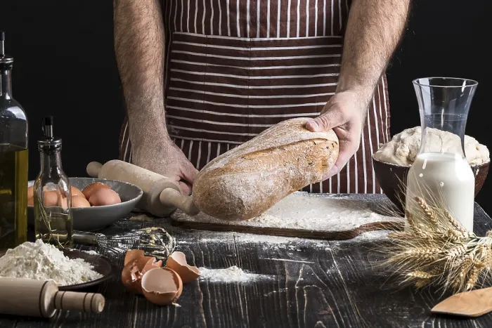 Framed Print : Chef Holds Fresh Bread Print on Black Background Framed Print : Chef Holds Fresh Bread Print on Black Background