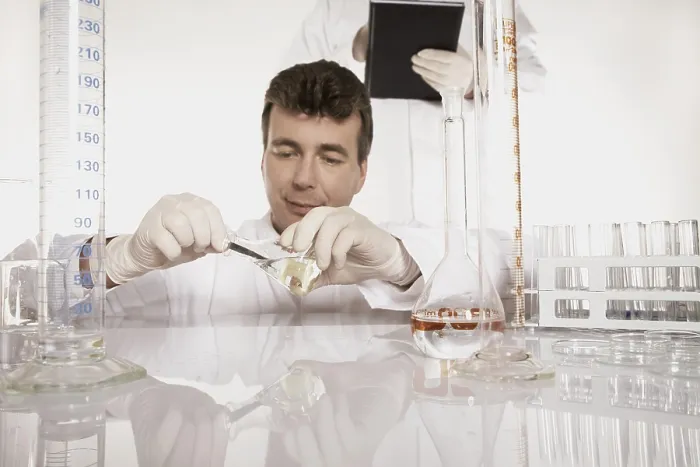Framed Print : Chemist Conducting Experiment in Lab Print Framed Print : Chemist Conducting Experiment in Lab Print