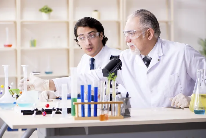 Framed Print : Two Chemists Working in the Lab Print Framed Print : Two Chemists Working in the Lab Print