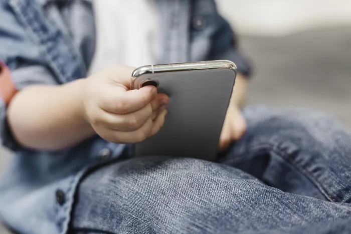 Framed Print : Child Using Mobile Phone Print Framed Print : Child Using Mobile Phone Print