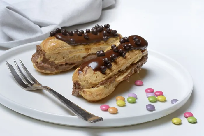 Framed Print : Two Chocolate Éclairs Print Framed Print : Two Chocolate Éclairs Print