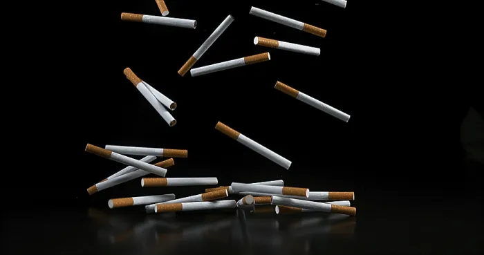 Framed Print : Cigarettes Falling Print against Black Background Framed Print : Cigarettes Falling Print against Black Background