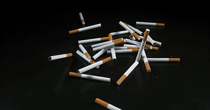 Framed Print : Cigarettes Falling Print against Black Background Framed Print : Cigarettes Falling Print against Black Background