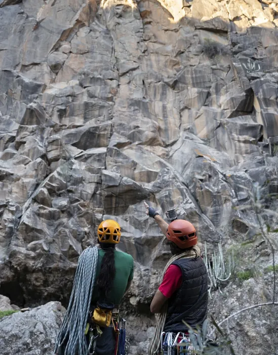 Framed Print : Two Climbers Assess a Rock Face - Print