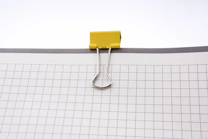 Framed Print : Clip on a Checked Notebook Print Framed Print : Clip on a Checked Notebook Print