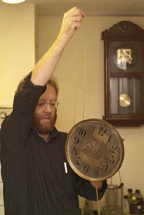 Framed Print : Clockmaker Restores Clock Print Framed Print : Clockmaker Restores Clock Print