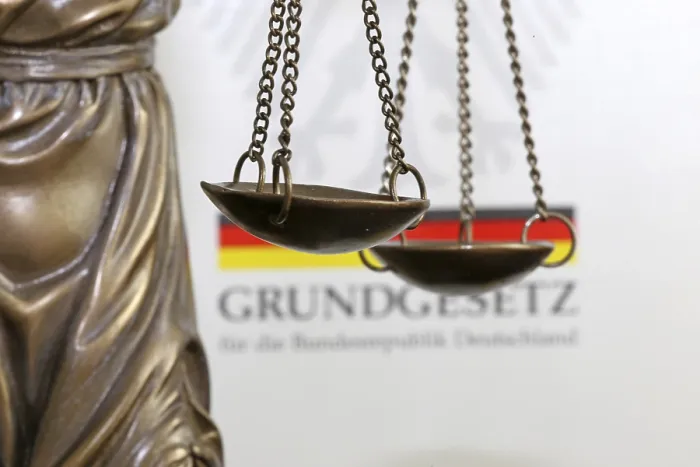 Framed Print : Close-up of a Justitia in front of the German constitution Print Framed Print : Close-up of a Justitia in front of the German constitution Print