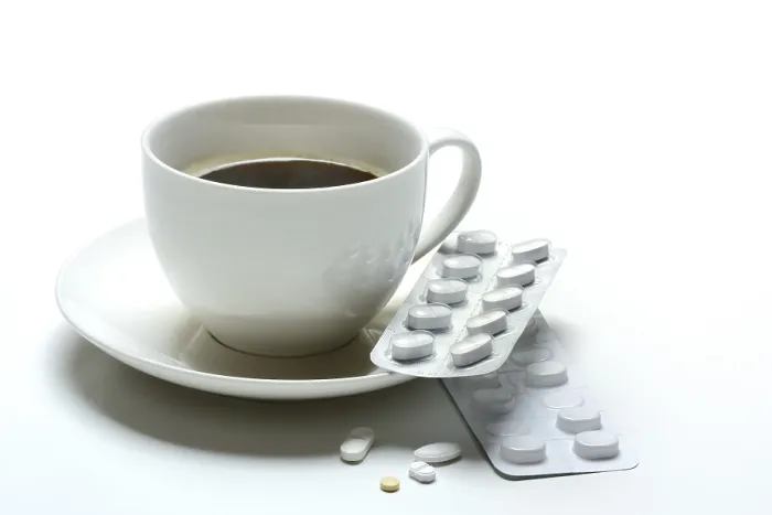 Framed Print : Coffee in a Cup with Medication Print Framed Print : Coffee in a Cup with Medication Print