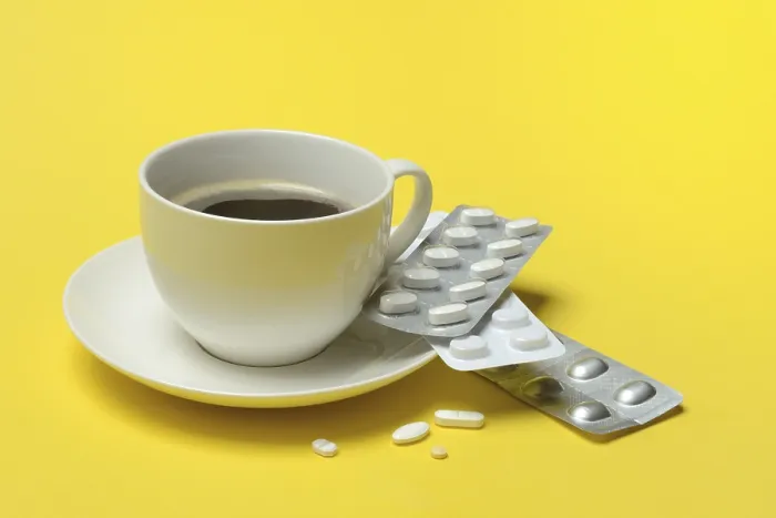 Framed Print : Coffee in a Cup with Medication Print Framed Print : Coffee in a Cup with Medication Print