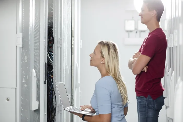 Framed Print : Colleagues working on maintaining a server room Print Framed Print : Colleagues working on maintaining a server room Print