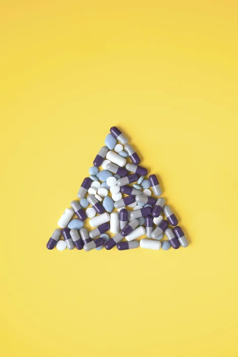 Framed Print : Assorted Pills Triangular Print on Yellow Background Framed Print : Assorted Pills Triangular Print on Yellow Background