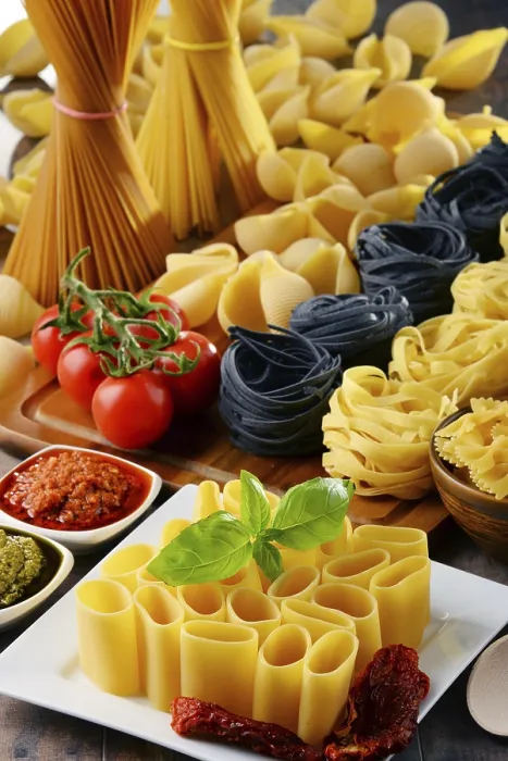 Framed Print : Composition with different sorts of pasta on kitchen table Print