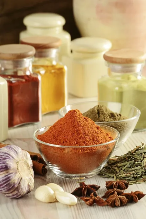 Framed Print : Composition with variety of spices on kitchen table Print