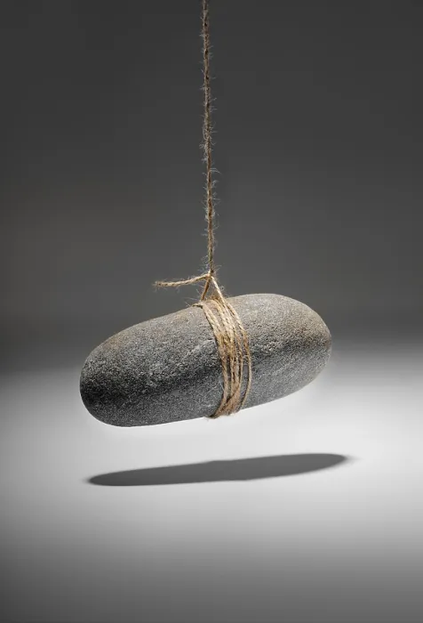 Framed Print : Conceptual Rock on a String Print Framed Print : Conceptual Rock on a String Print
