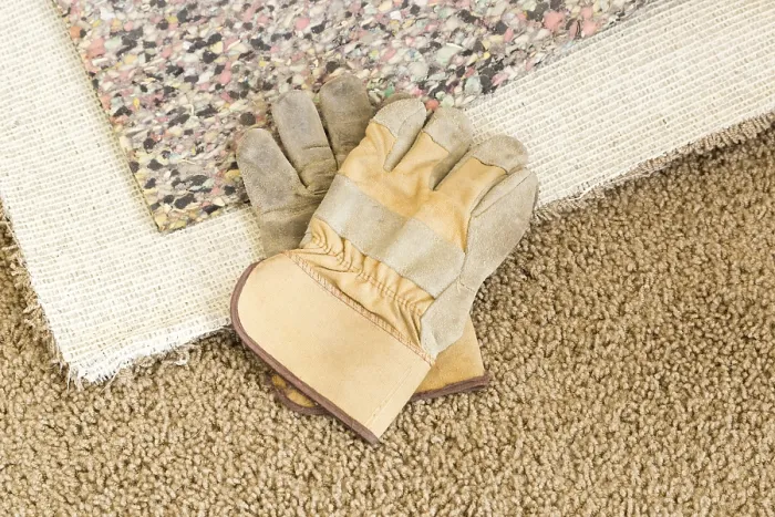 Framed Print : Construction Gloves on Pulled Back Carpet Print