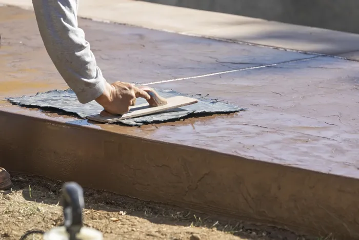 Framed Print : Construction Worker Texturing Wet Cement Print Framed Print : Construction Worker Texturing Wet Cement Print