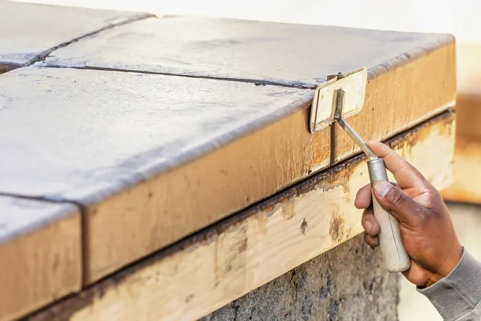 Framed Print : Construction Worker Using Hand Groover On Wet Cement Print