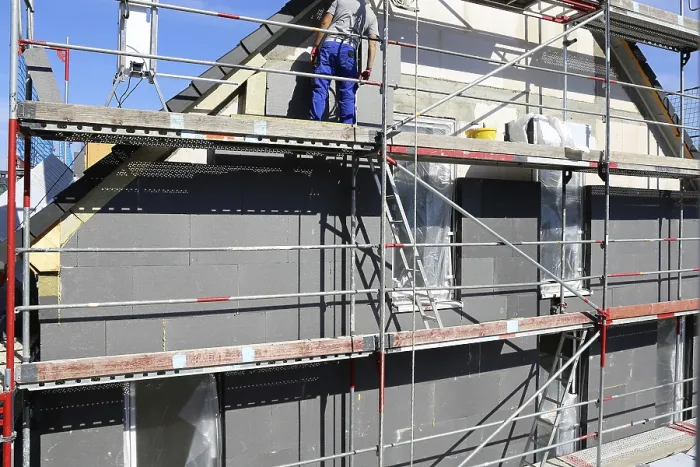 Framed Print : Construction Workers Insulate House Facade Print Framed Print : Construction Workers Insulate House Facade Print