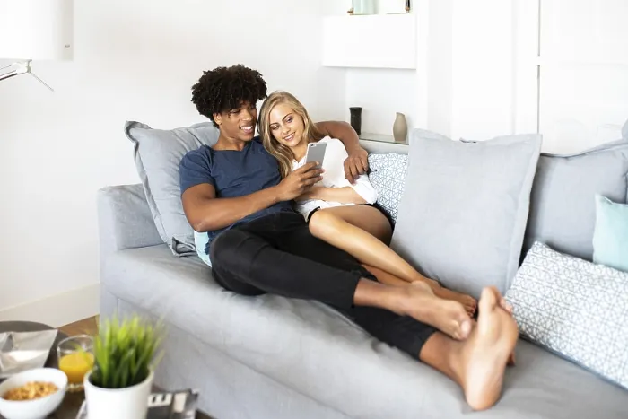 Framed Print : Cozy Moment Print: Couple on Sofa Framed Print : Cozy Moment Print: Couple on Sofa