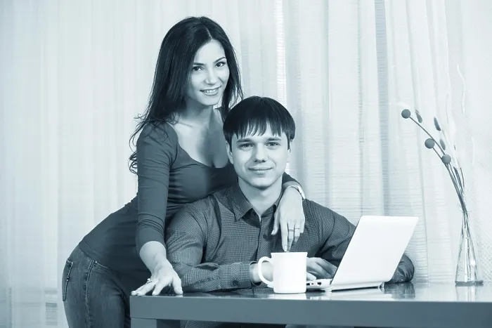 Framed Print : Couple Having Coffee While Using Laptop Print Framed Print : Couple Having Coffee While Using Laptop Print
