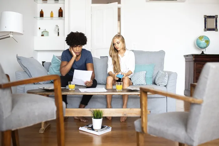 Framed Print : Modern Couple Analyzing Finances Print Framed Print : Modern Couple Analyzing Finances Print