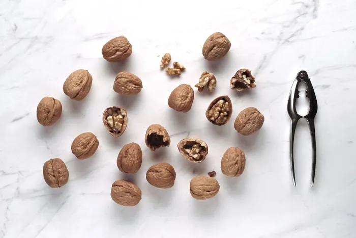 Framed Print : Walnuts on Marble with Nutcracker Print Framed Print : Walnuts on Marble with Nutcracker Print