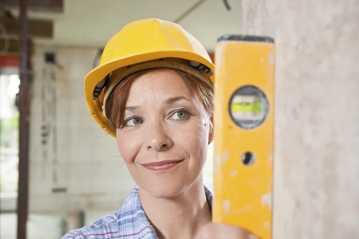 Framed Print : Craftswoman with Hard Hat Checking Level Print Framed Print : Craftswoman with Hard Hat Checking Level Print