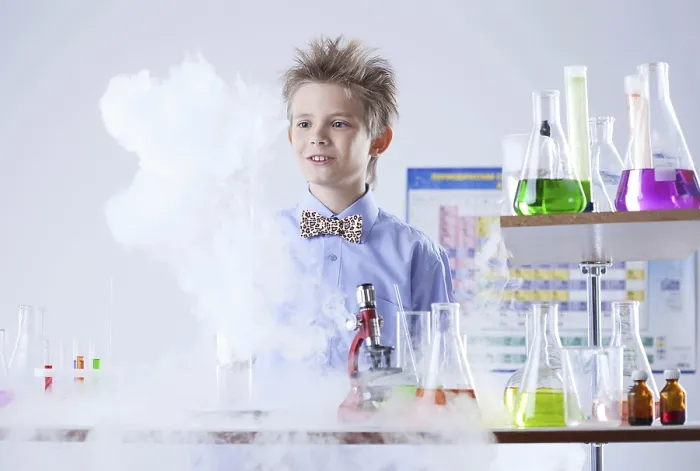 Framed Print : Curious pupil posing with test tubes and flasks print Framed Print : Curious pupil posing with test tubes and flasks print