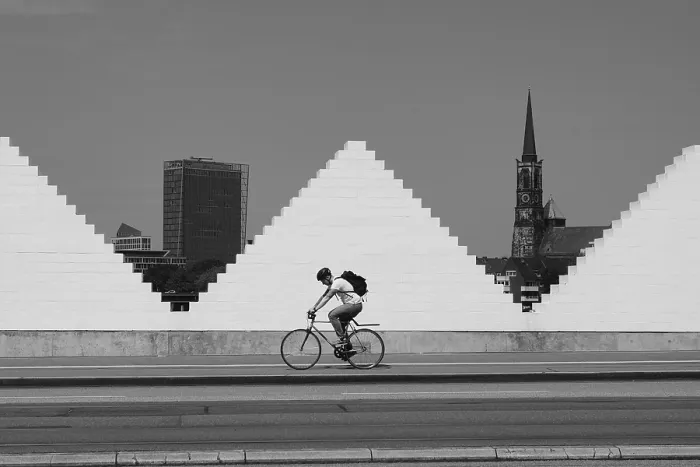 Framed Print : Cyclist in front of white wall Print, Bremen, Germany Framed Print : Cyclist in front of white wall Print, Bremen, Germany