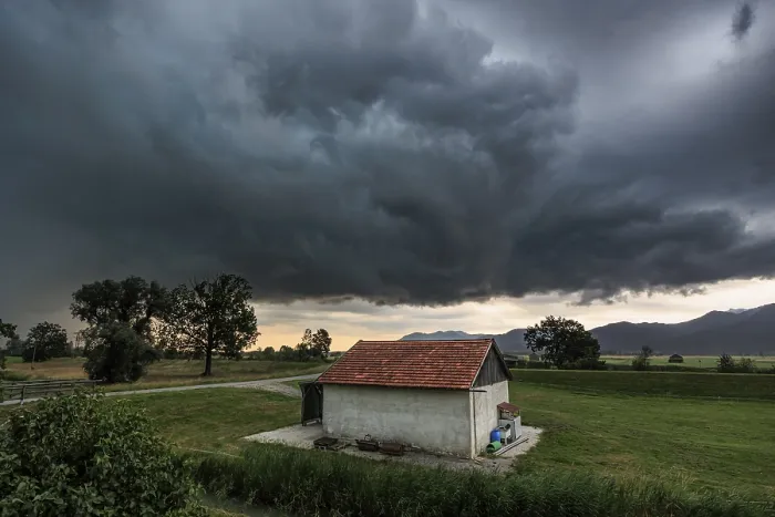 Framed Print : Dark Storm Clouds Over Small Barn Print