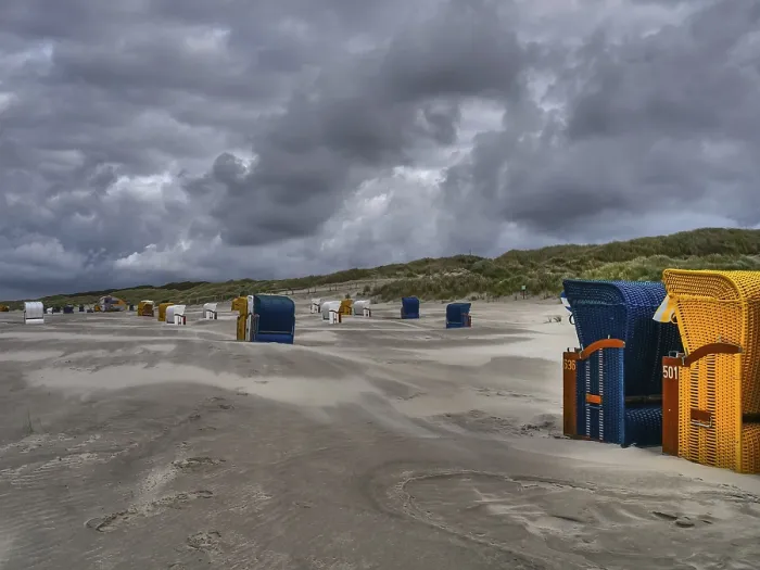 Framed Print : Deserted Beach Print with Colourful Chairs Under Overcast Sky Framed Print : Deserted Beach Print with Colourful Chairs Under Overcast Sky