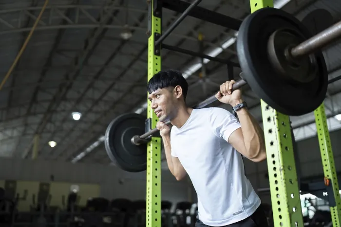 Framed Print : A Determined Young Man Performs Squats with a Barbell Print Framed Print : A Determined Young Man Performs Squats with a Barbell Print