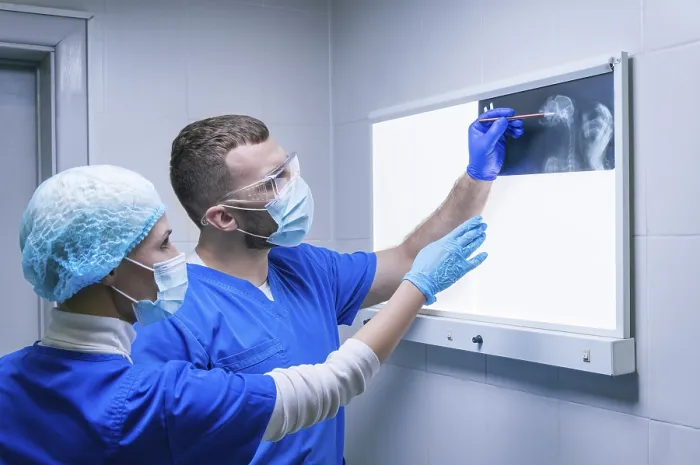 Framed Print : Radiology Print: Two Doctors Examine an X-ray Framed Print : Radiology Print: Two Doctors Examine an X-ray