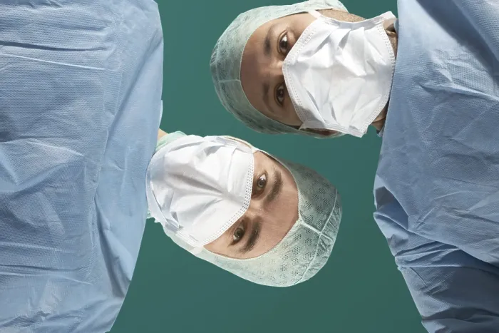 Framed Print : Two Doctors Examine a Patient Print Framed Print : Two Doctors Examine a Patient Print