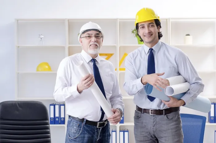 Framed Print : Two Engineers Working Under Project Print
