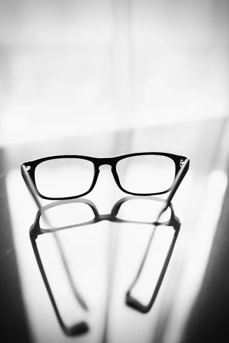 Framed Print : Eyeglasses on Glass Table Print with Reflection Framed Print : Eyeglasses on Glass Table Print with Reflection
