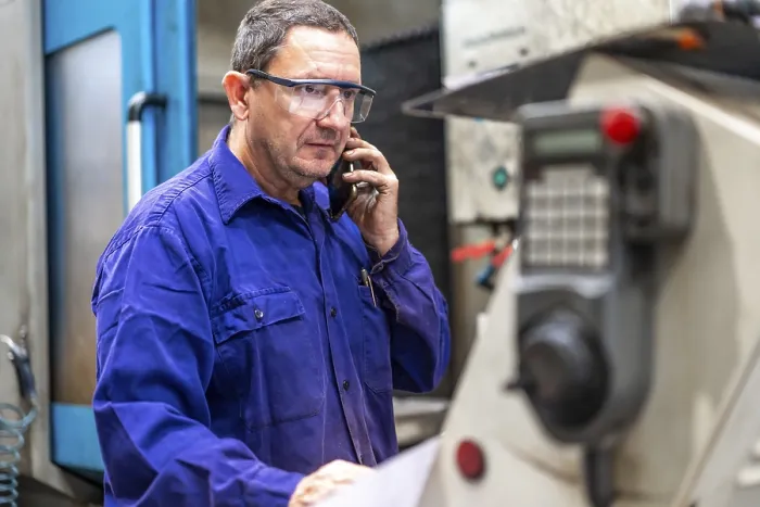 Framed Print : Numerical Control Factory Worker on Phone Print Framed Print : Numerical Control Factory Worker on Phone Print