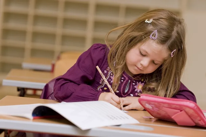 Framed Print : Firstgrader during a lesson Print Framed Print : Firstgrader during a lesson Print