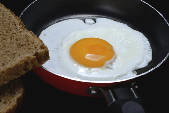 Framed Print : Print of Fried Egg in a Pan with Crispy Fried Chicken Framed Print : Print of Fried Egg in a Pan with Crispy Fried Chicken