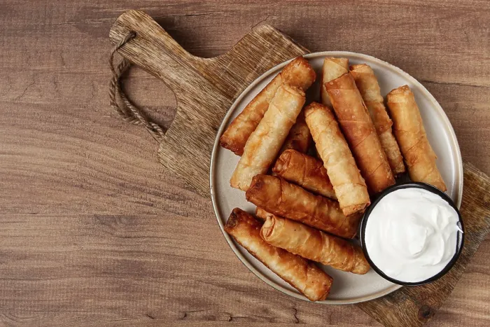 Framed Print : Fried Spring Rolls with Cheese Print on Wooden Background Framed Print : Fried Spring Rolls with Cheese Print on Wooden Background